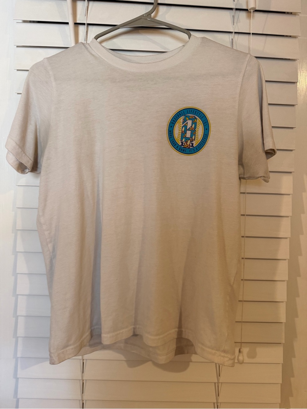 White Short-Sleeve Tee with Small Blue & Yellow Patch